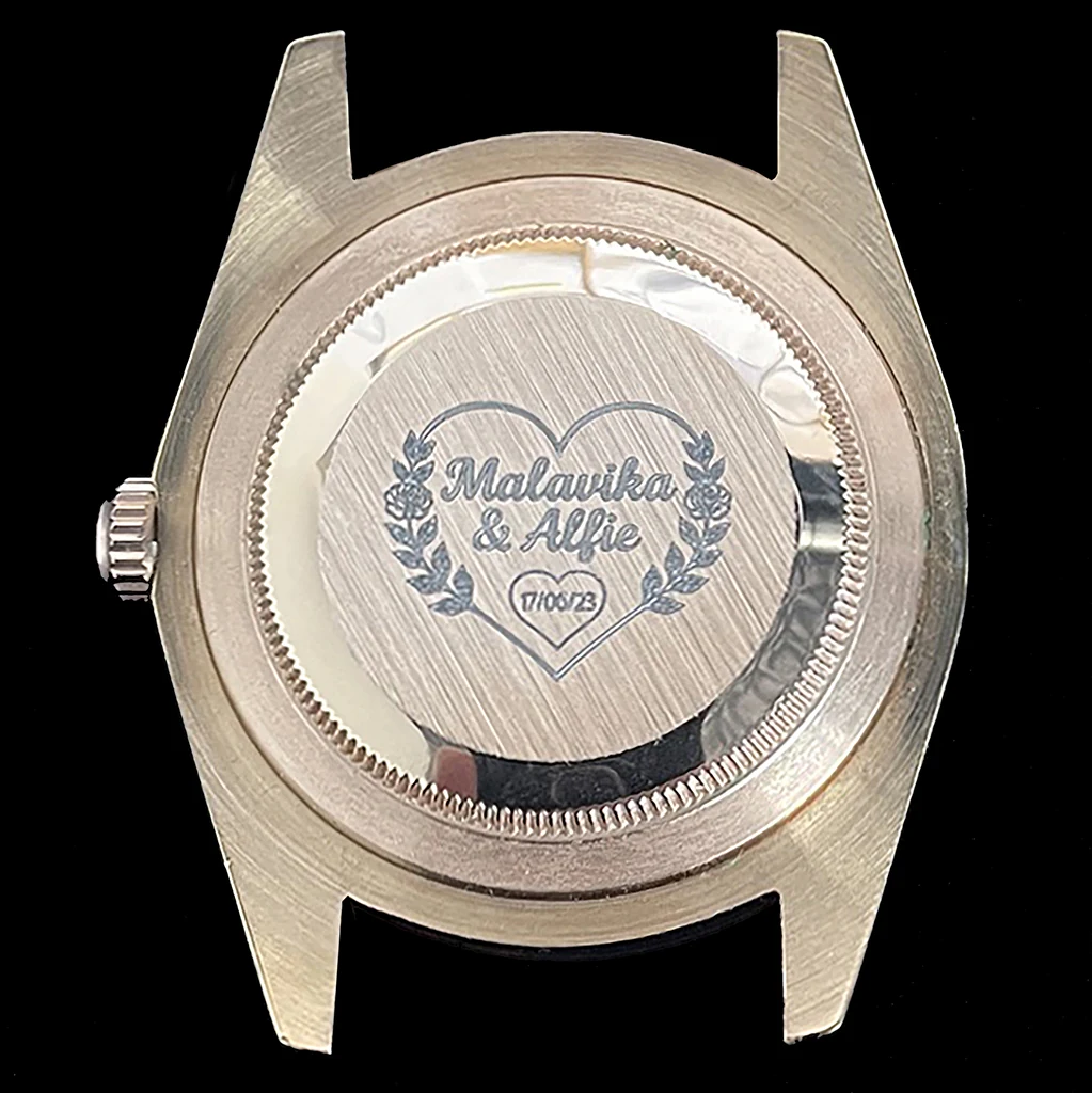 Precision laser engraving on the back of a metal watch