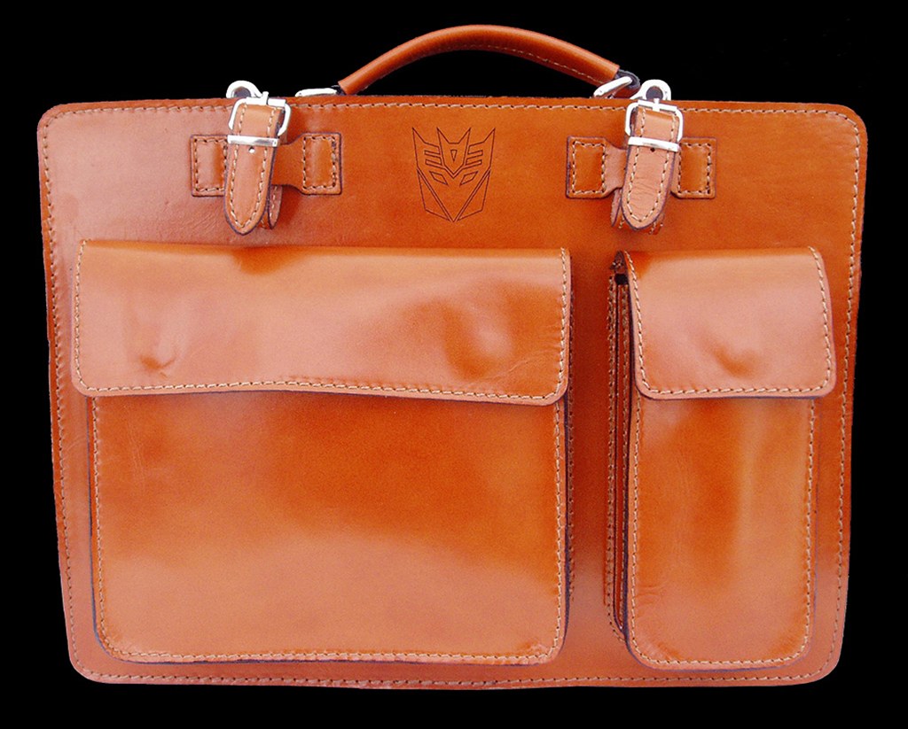 Brown leather case with bespoke embossed emblem by Furnells